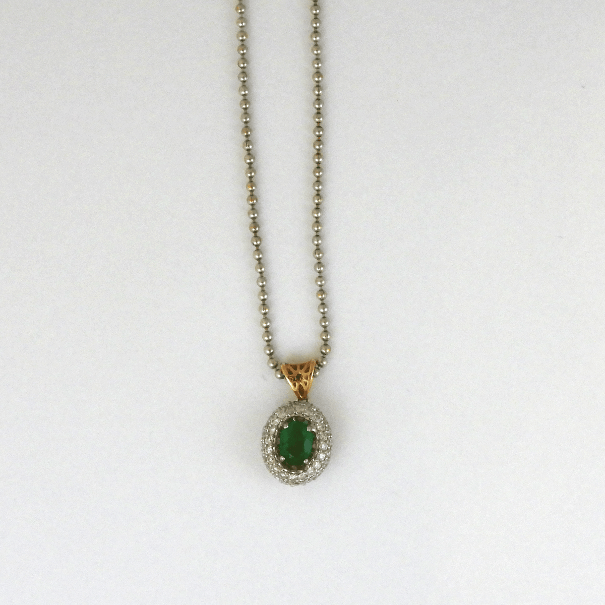 Oval Emerald with Two Rows of Diamonds